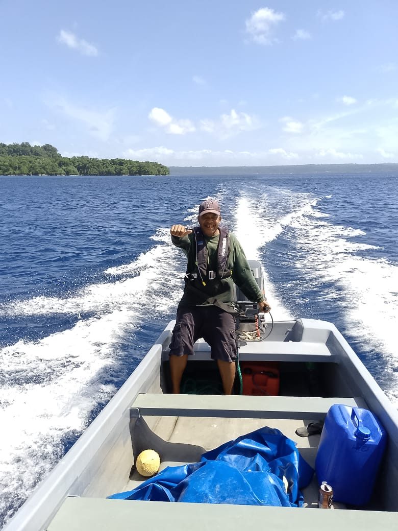 Customs Marine officer at the helm of a patrol boat