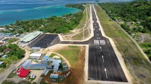 Aerial view of an airport runway near the coast